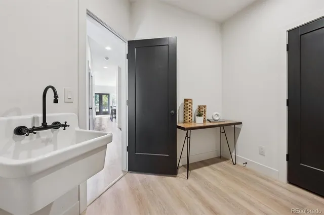 a kitchen with a sink and a refrigerator