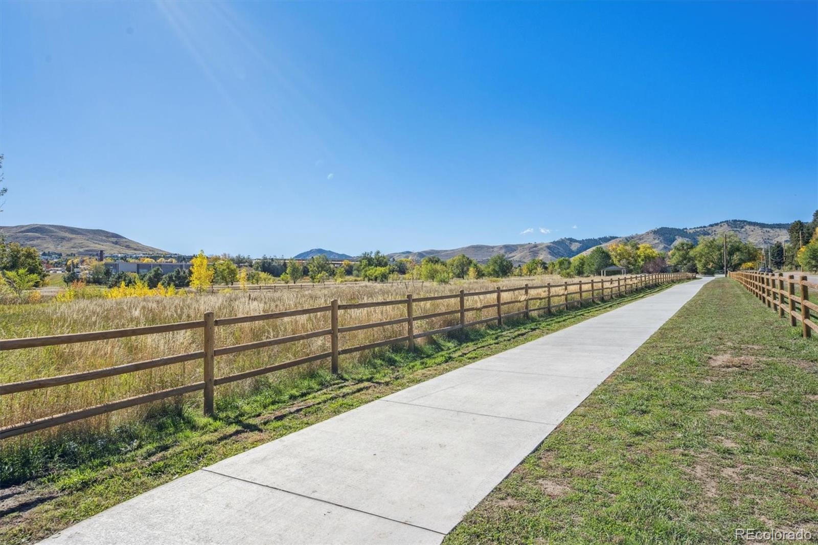 16180 Mt Vernon Road Golden, CO 80401 - Photo 35 of 44 a view of a green field with an ocean view