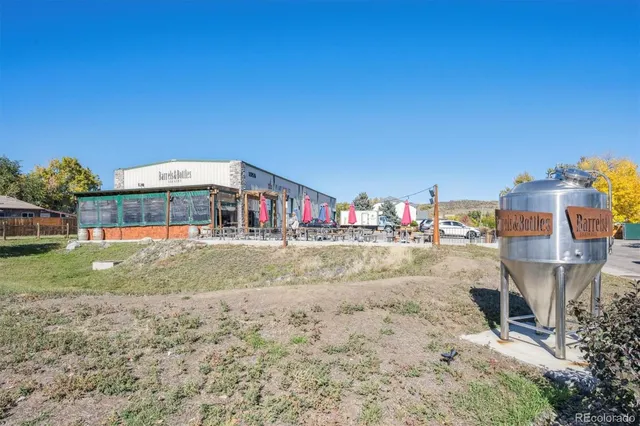 a multi story building with trees in the background