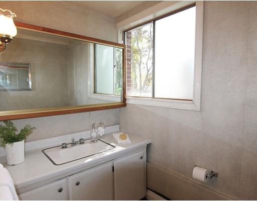 16 Foster Road Lexington, MA 02421 - Photo 13 of 21 a bathroom with a sink and a vanity