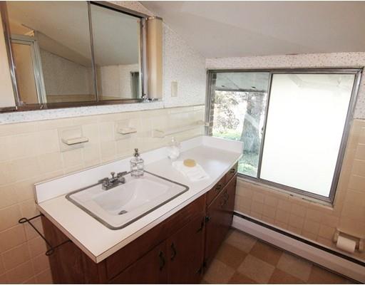16 Foster Road Lexington, MA 02421 - Photo 17 of 21 a bathroom with a sink and a mirror