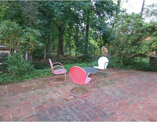 16 Foster Road Lexington, MA 02421 - Photo 21 of 21 a view of a table and chairs in the backyard