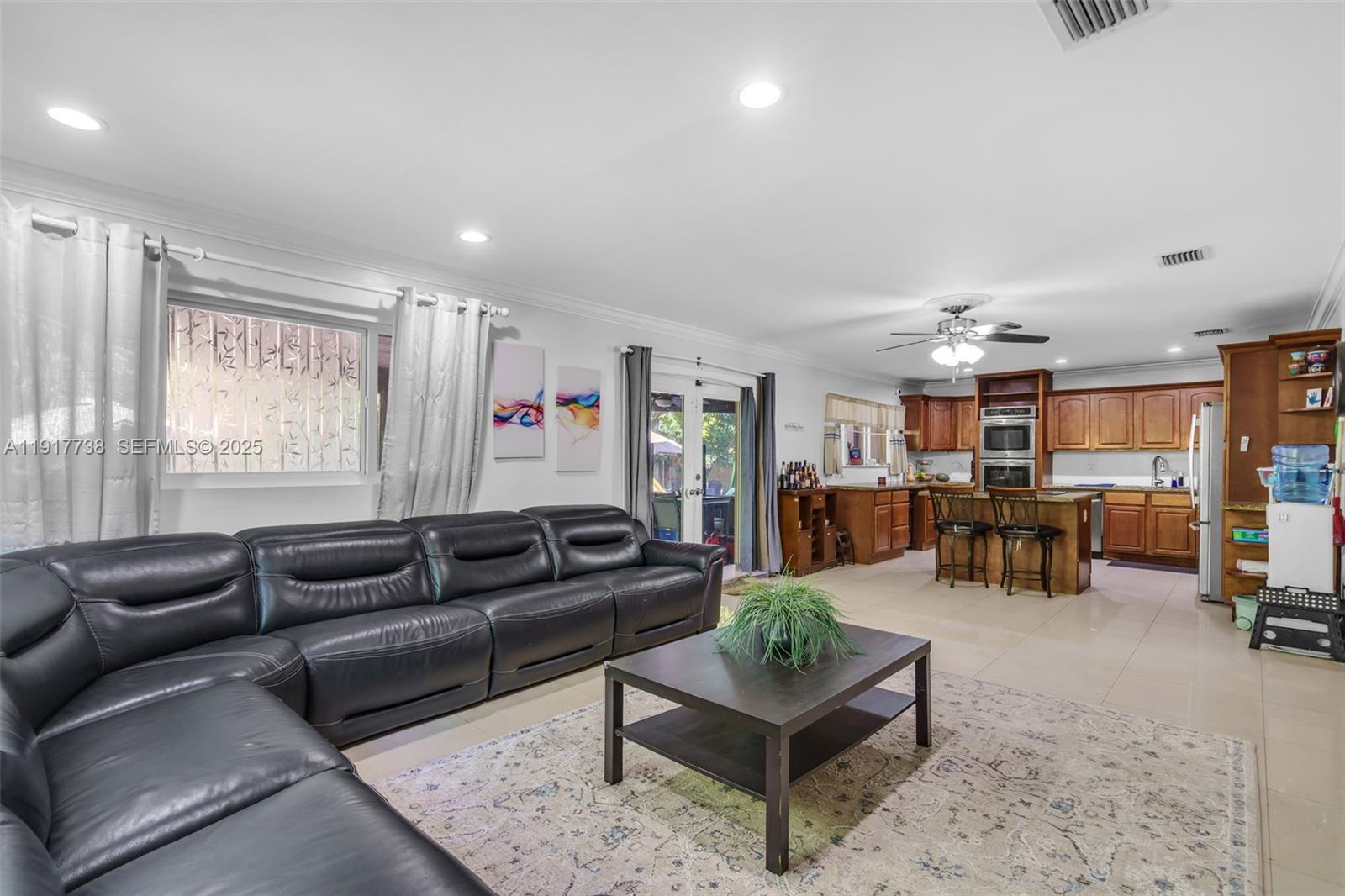 3135 Southwest 80th Avenue Miami, FL 33155 - Photo 11 of 65 a living room with furniture and a table