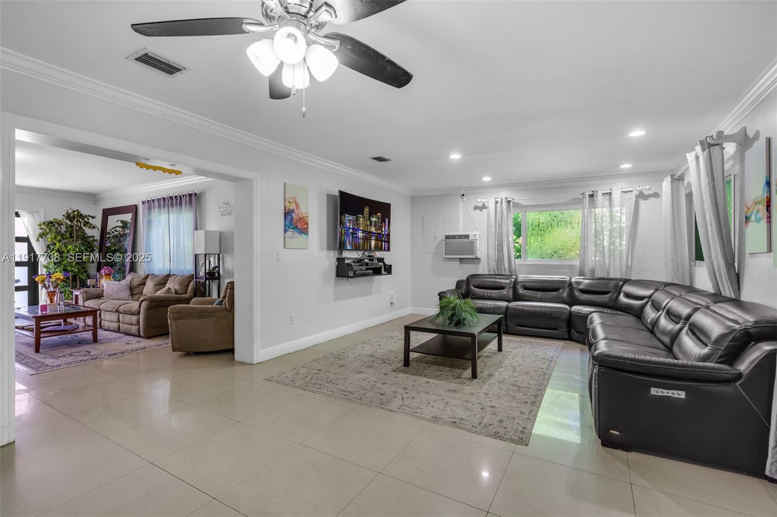 3135 Southwest 80th Avenue Miami, FL 33155 - Photo 17 of 65 a living room with furniture and a large window