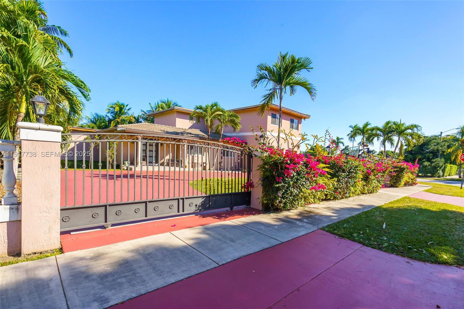 3135 Southwest 80th Avenue Miami, FL 33155 - Photo 2 of 65 a view of a house with a yard and potted plants