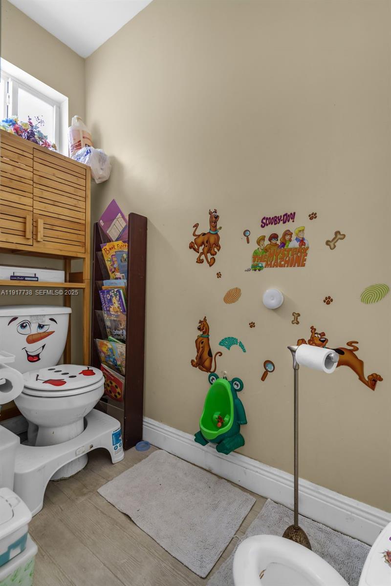 3135 Southwest 80th Avenue Miami, FL 33155 - Photo 29 of 65 a living room with furniture a rug and a table