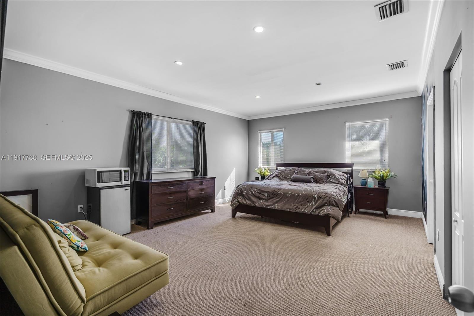 3135 Southwest 80th Avenue Miami, FL 33155 - Photo 33 of 65 a spacious bedroom with a bed and furniture