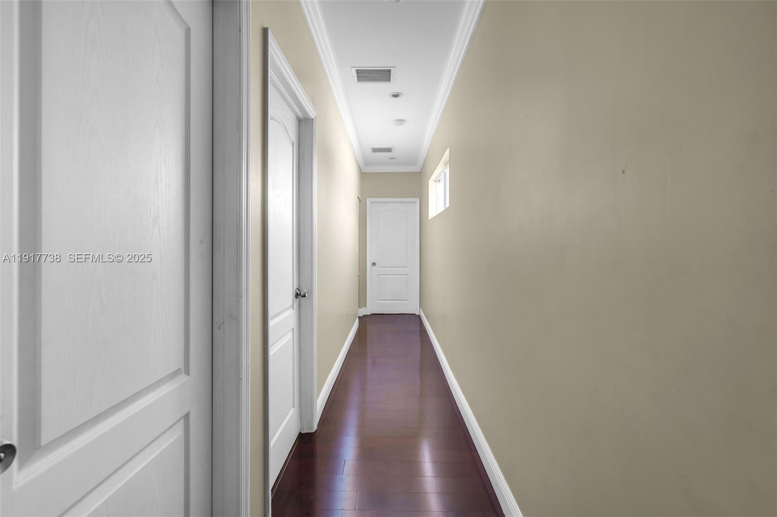3135 Southwest 80th Avenue Miami, FL 33155 - Photo 43 of 65 a view of a hallway with wooden floor and staircase