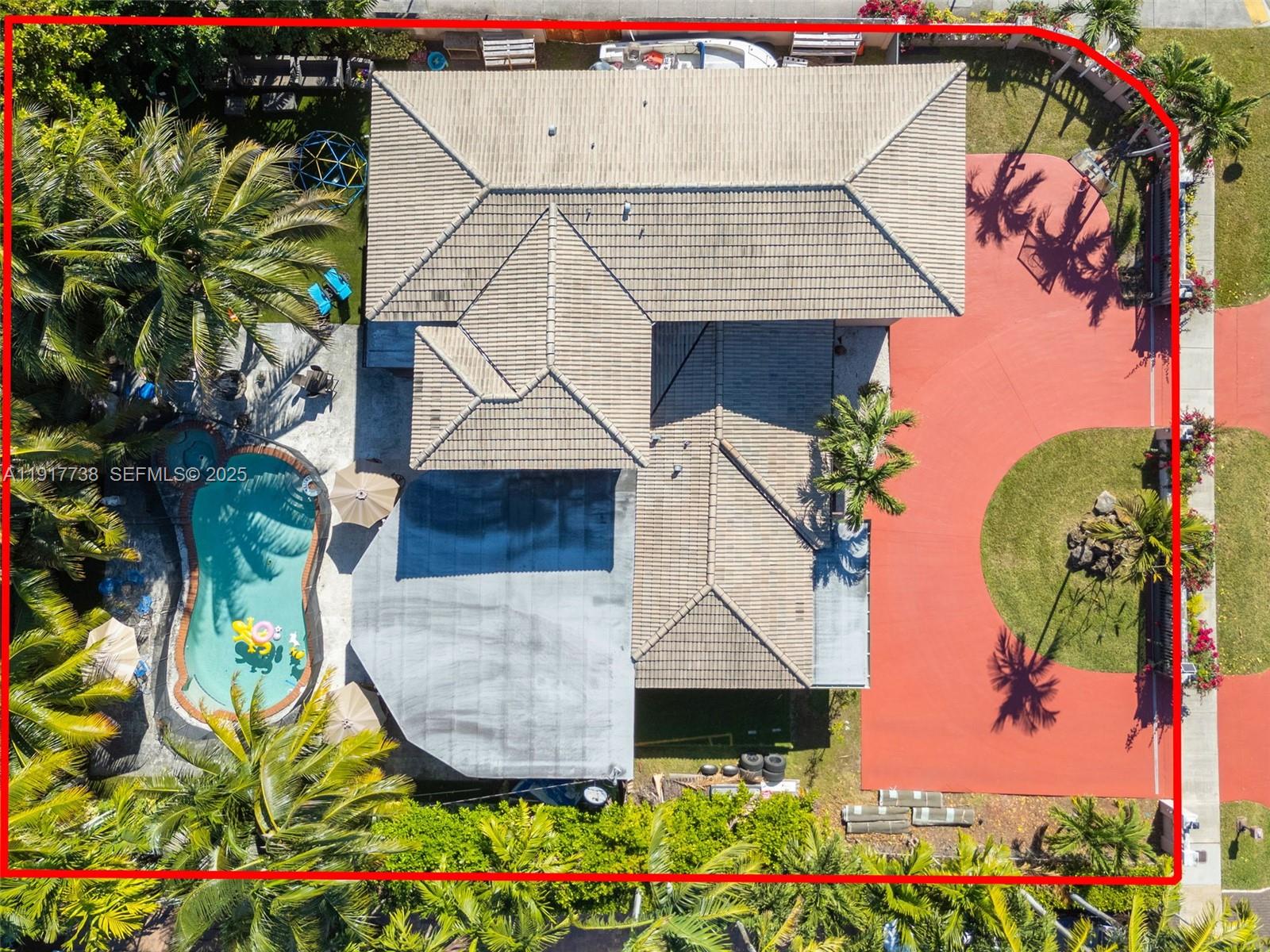 3135 Southwest 80th Avenue Miami, FL 33155 - Photo 64 of 65 an aerial view of a house with a yard and potted plants