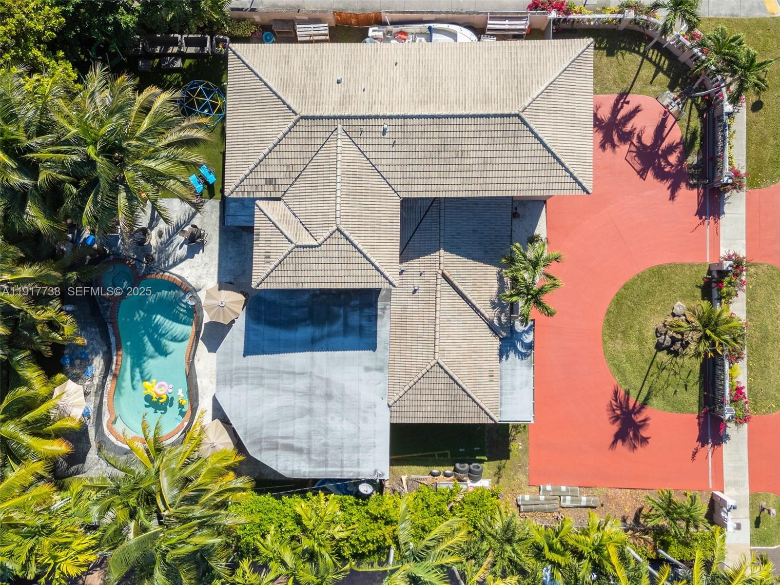 3135 Southwest 80th Avenue Miami, FL 33155 - Photo 65 of 65 an aerial view of a house with a yard and potted plants