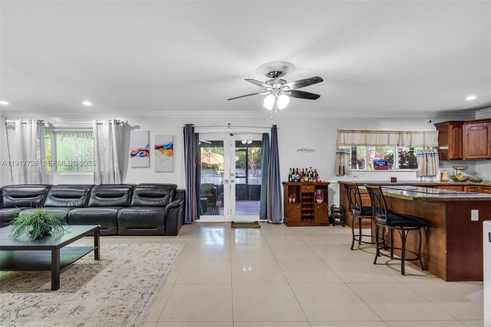 3135 Southwest 80th Avenue Miami, FL 33155 - Photo 10 of 65 a living room with furniture and a flat screen tv