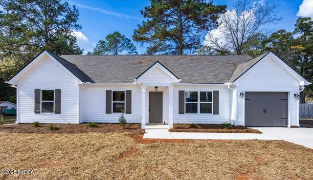 front view of a house with a yard
