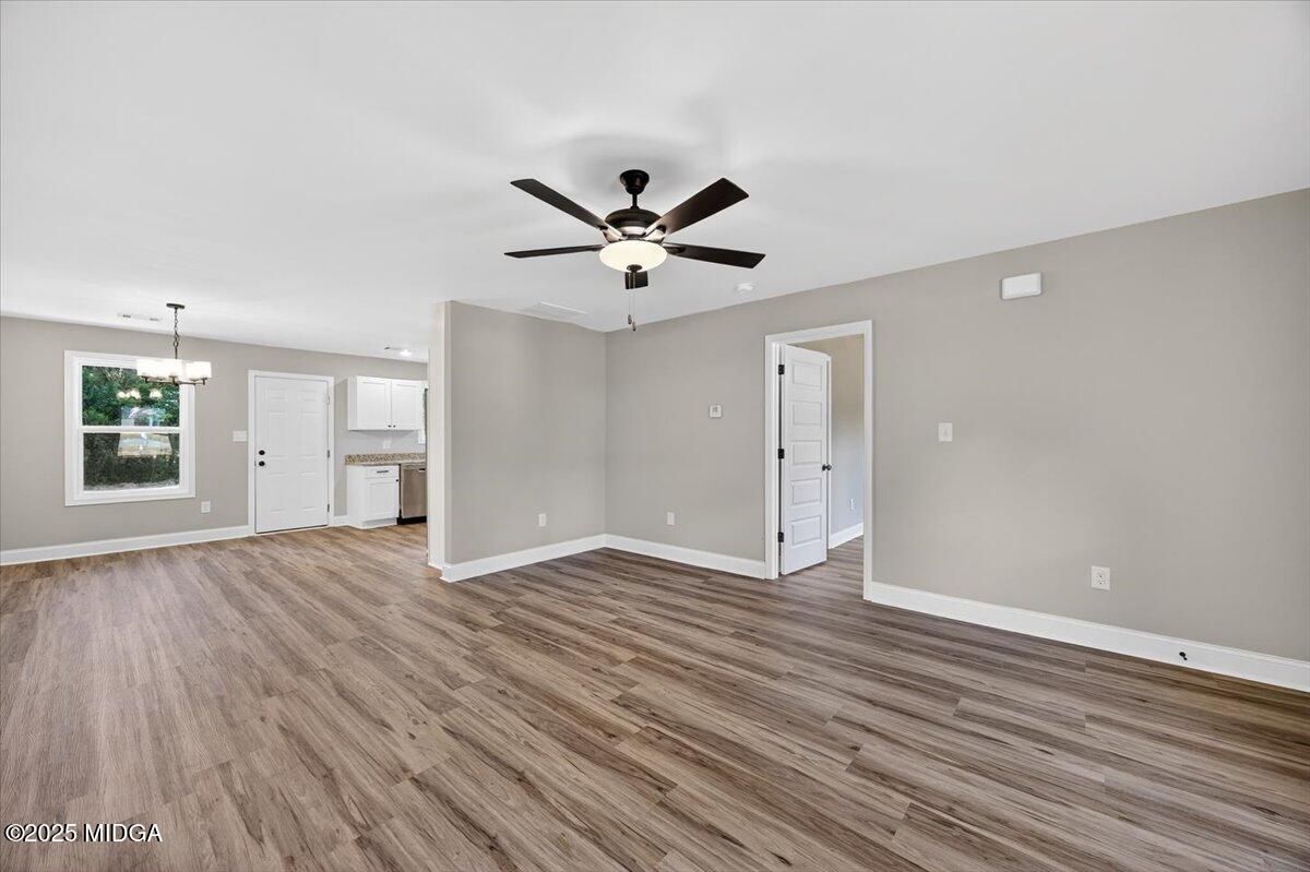 315 Lee Street Perry, GA 31069 - Photo 6 of 26 an empty room with fan and windows