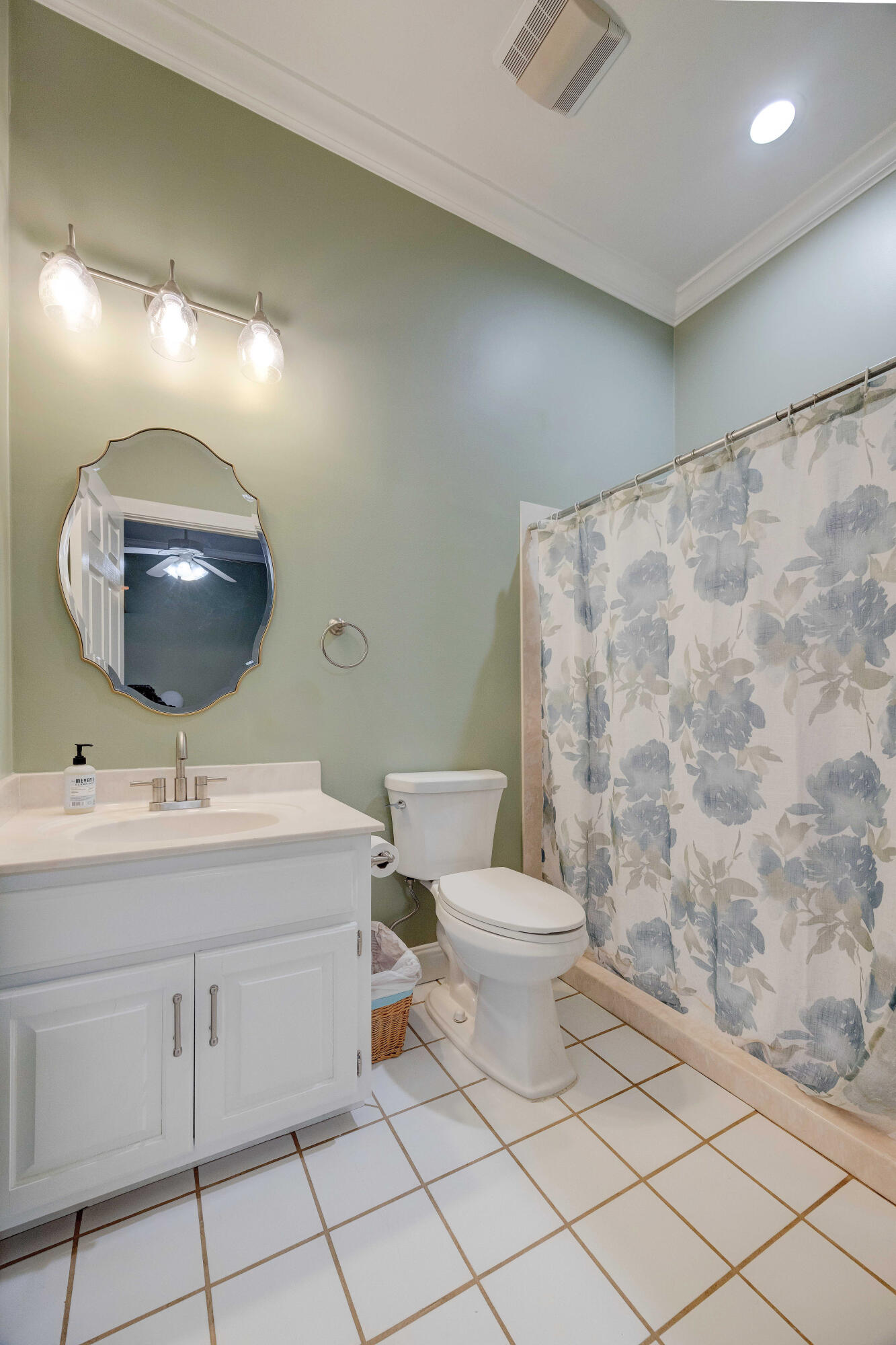 1111 Tallokas Road Crestview, FL 32536 - Photo 23 of 56 a bathroom with a toilet a sink and mirror