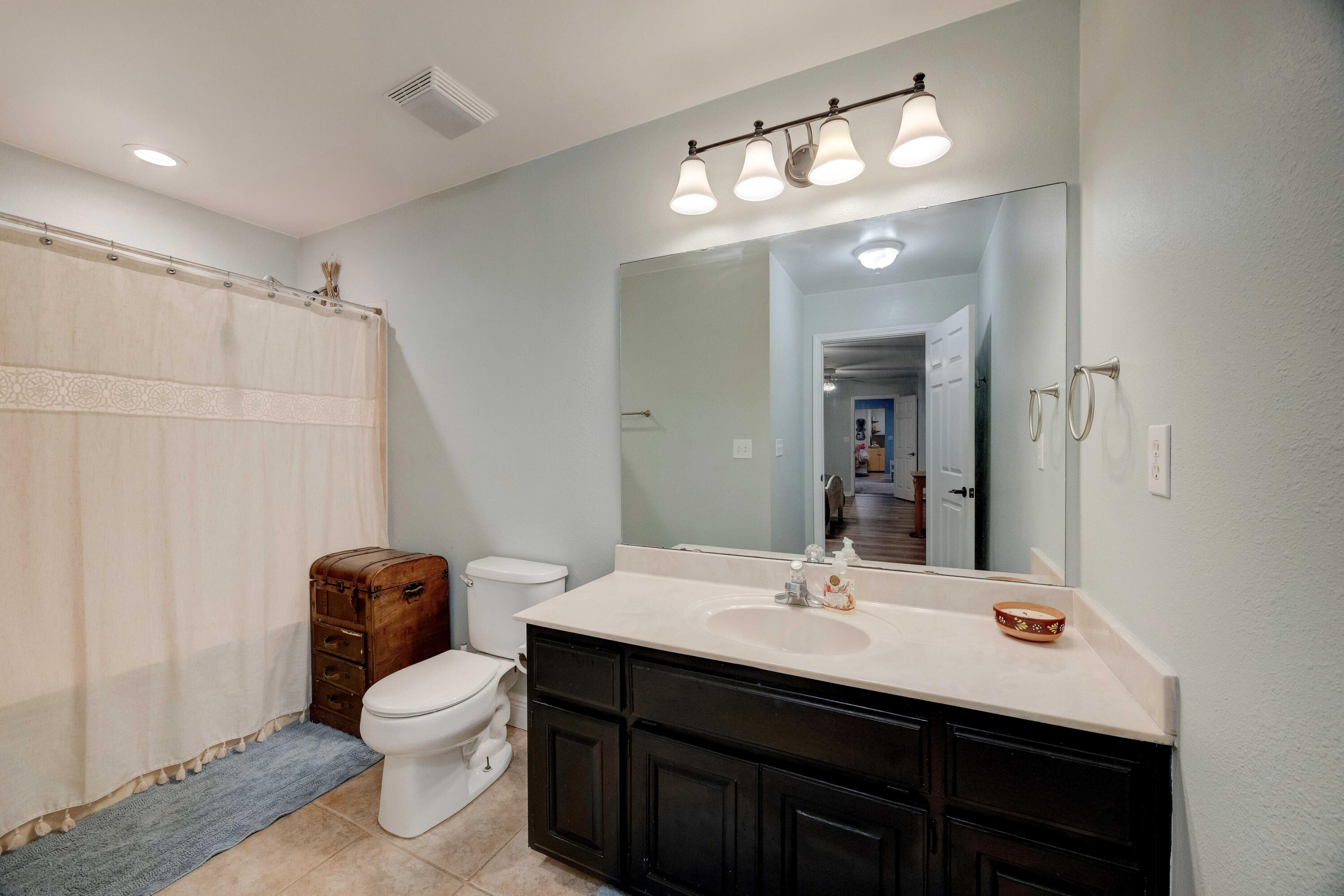 1111 Tallokas Road Crestview, FL 32536 - Photo 27 of 56 a bathroom with a sink a toilet and a mirror