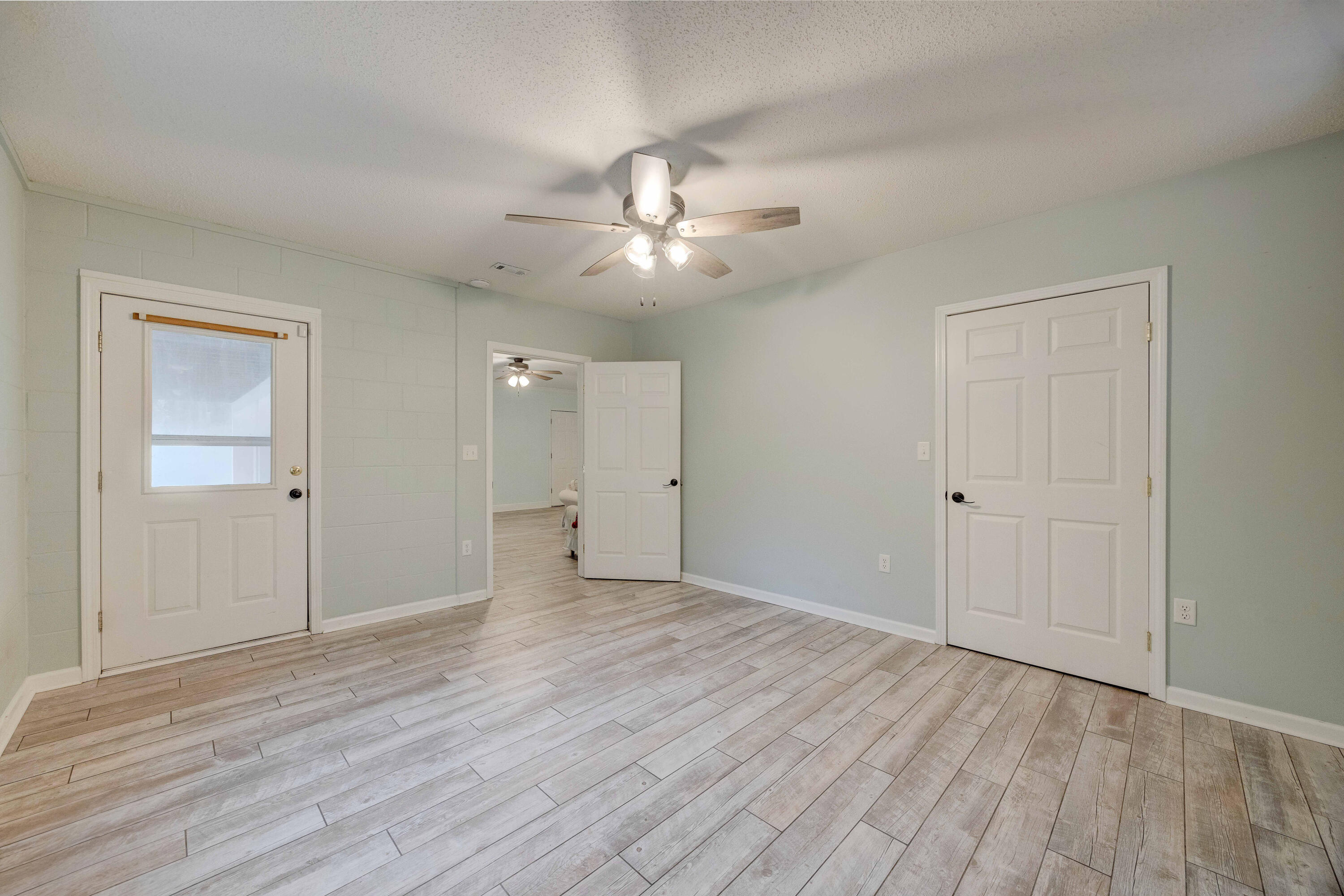 1111 Tallokas Road Crestview, FL 32536 - Photo 31 of 56 a view of an empty room and chandelier fan