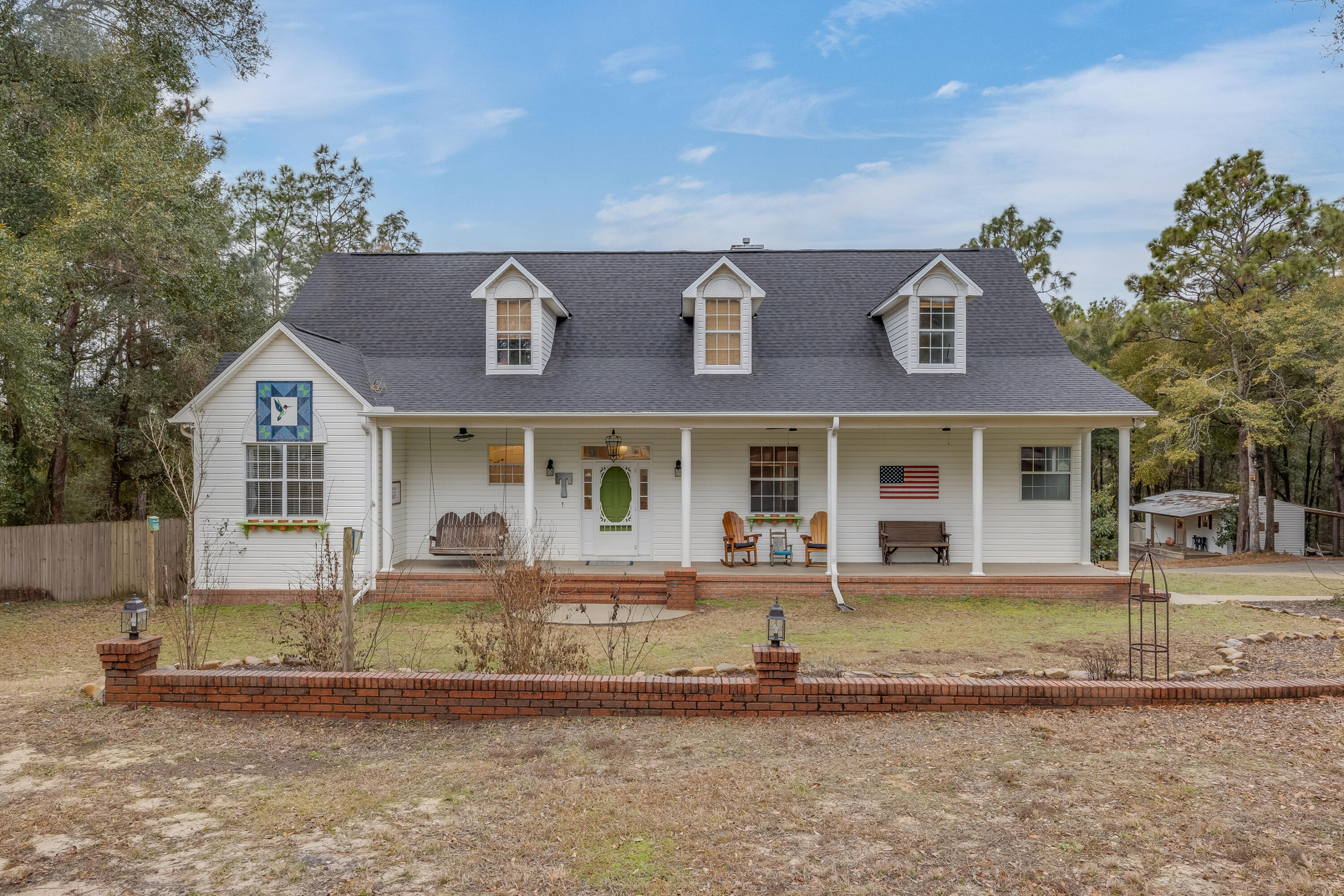 1111 Tallokas Road Crestview, FL 32536 - Photo 4 of 56 front view of a house with a yard