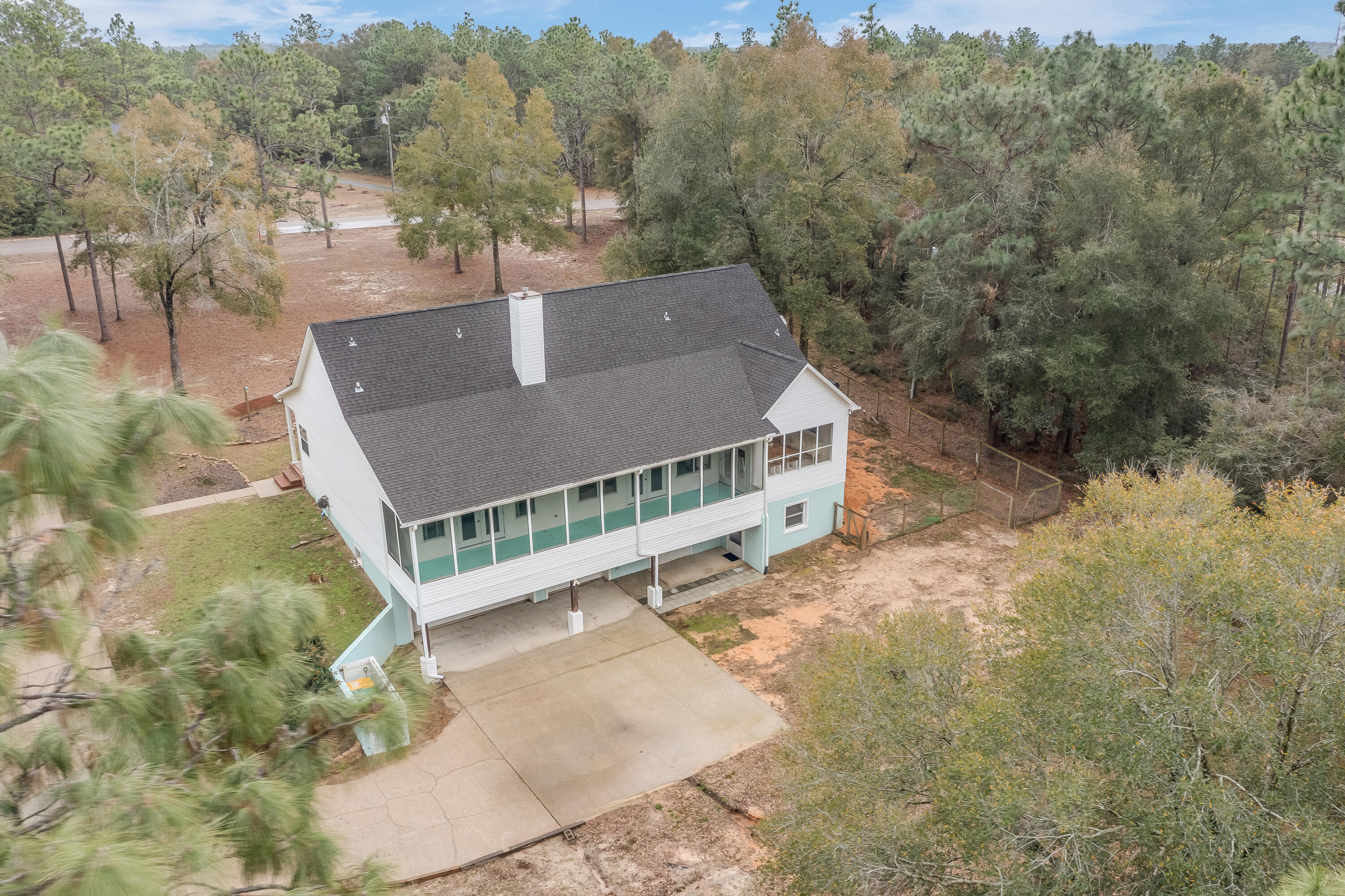 1111 Tallokas Road Crestview, FL 32536 - Photo 44 of 56 a view of a house with a yard