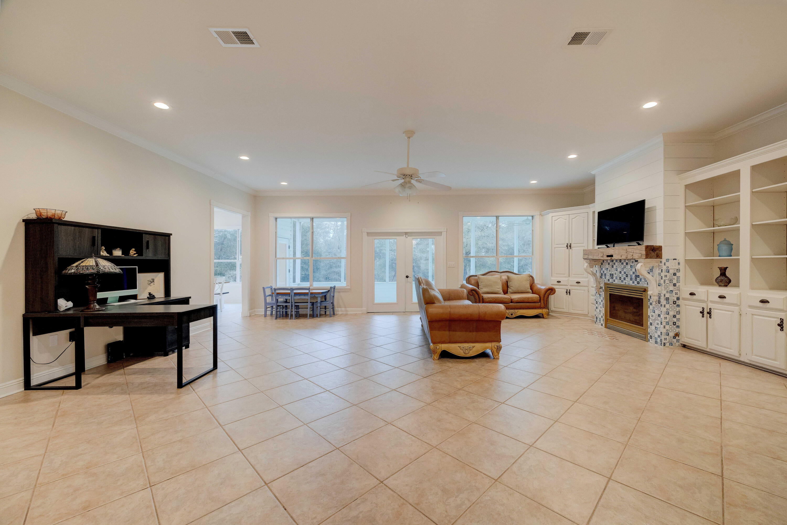 1111 Tallokas Road Crestview, FL 32536 - Photo 9 of 56 a living room with furniture and a flat screen tv
