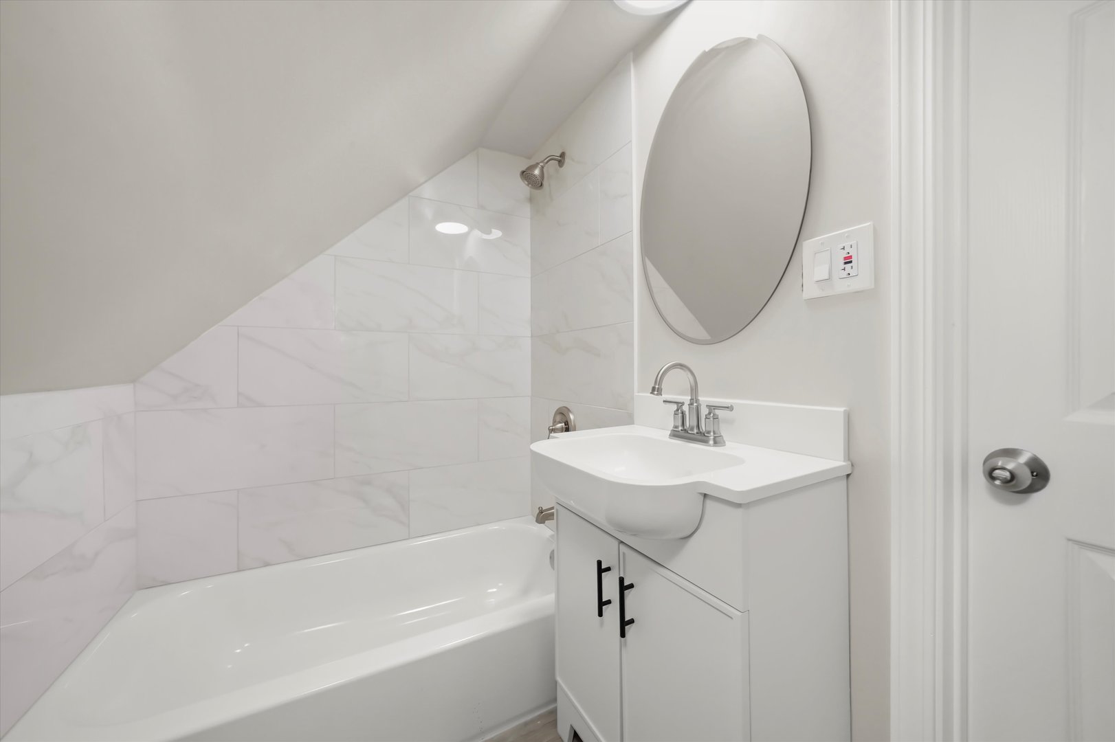 2510 North Linder Avenue Chicago, IL 60639 - Photo 18 of 30 a bathroom with a sink and a mirror