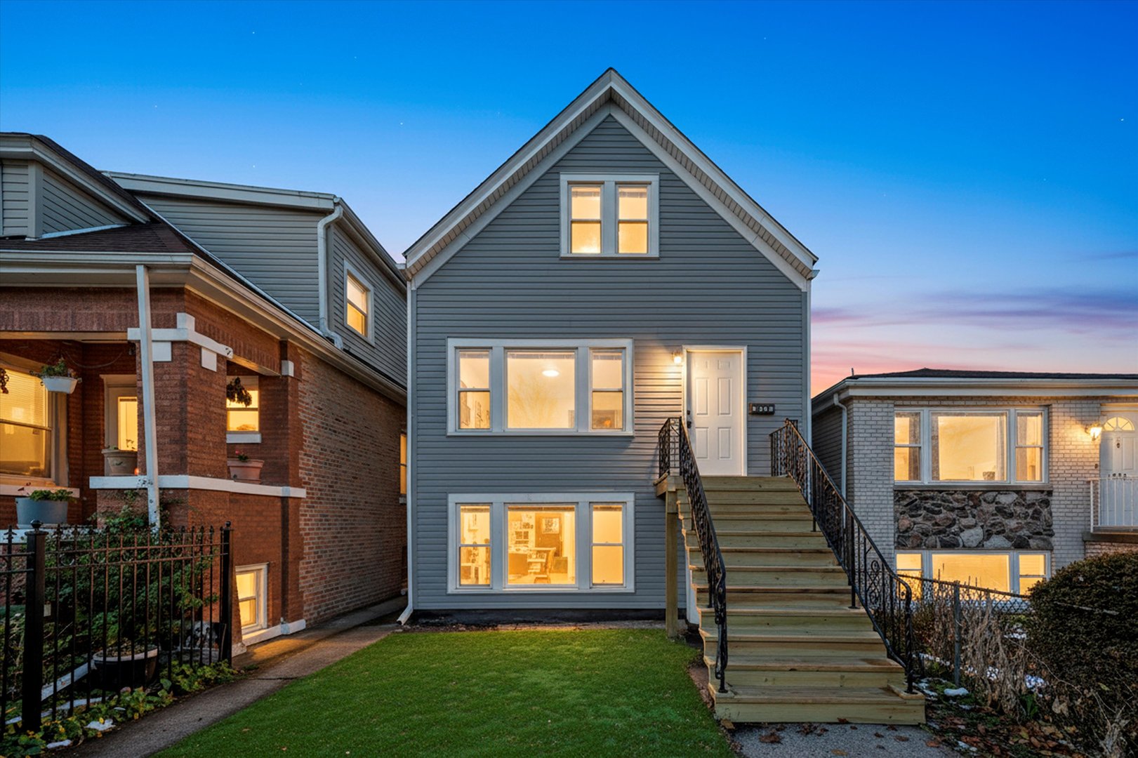 2510 North Linder Avenue Chicago, IL 60639 - Photo 2 of 30 a front view of a house with a yard