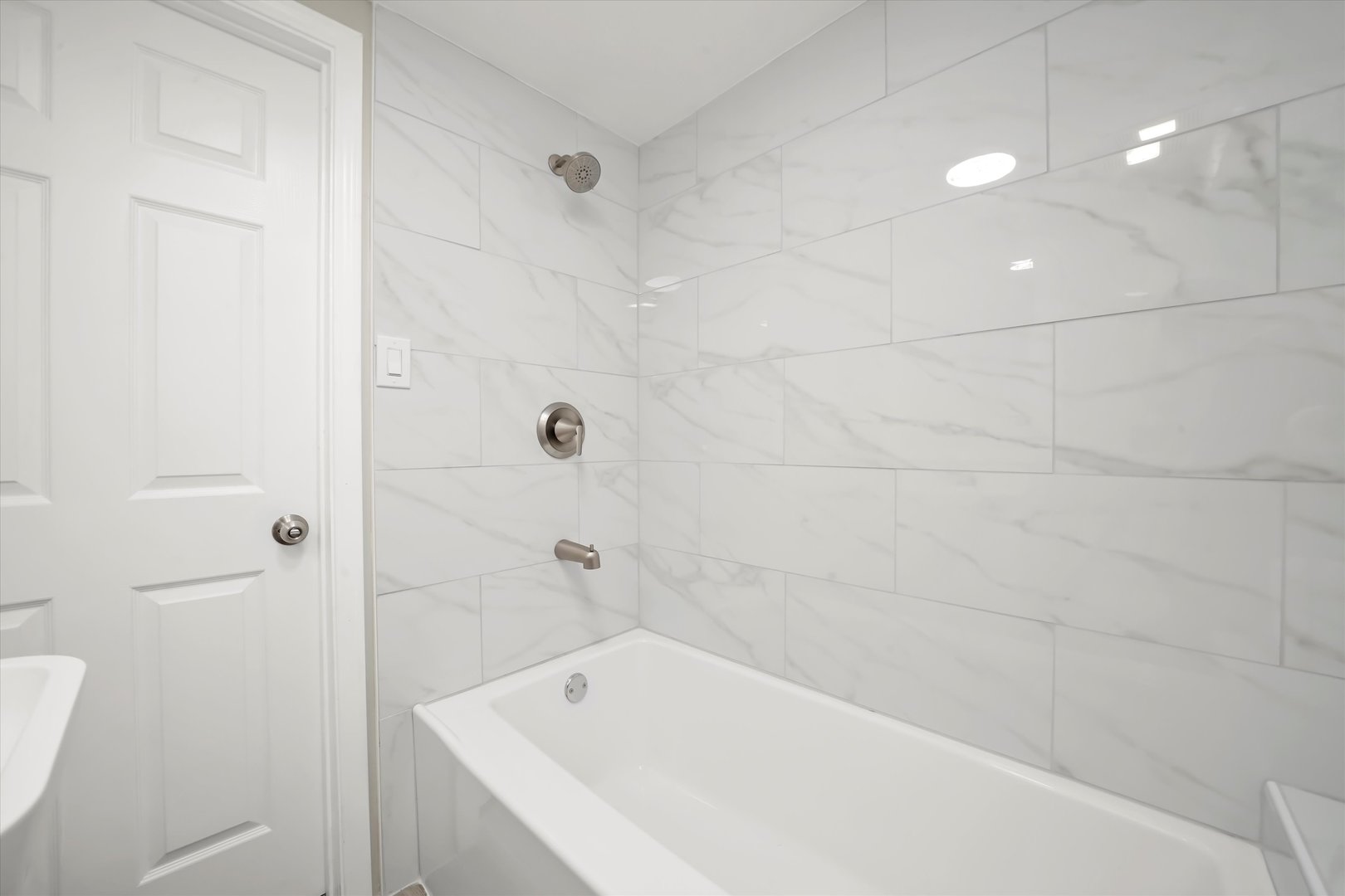 2510 North Linder Avenue Chicago, IL 60639 - Photo 26 of 30 a bathroom with a bathtub and shower