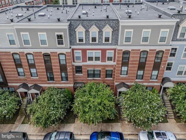 front view of a building with a garden