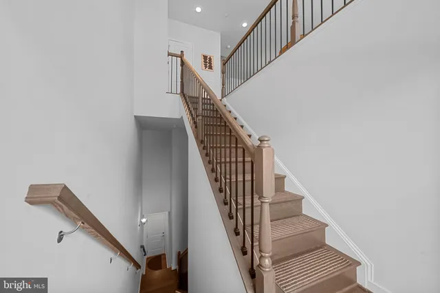 a front view of a residential apartment building with glass windows