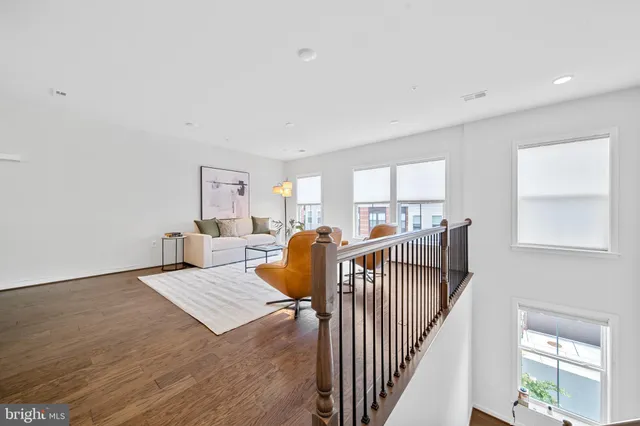a living room with furniture and a rug