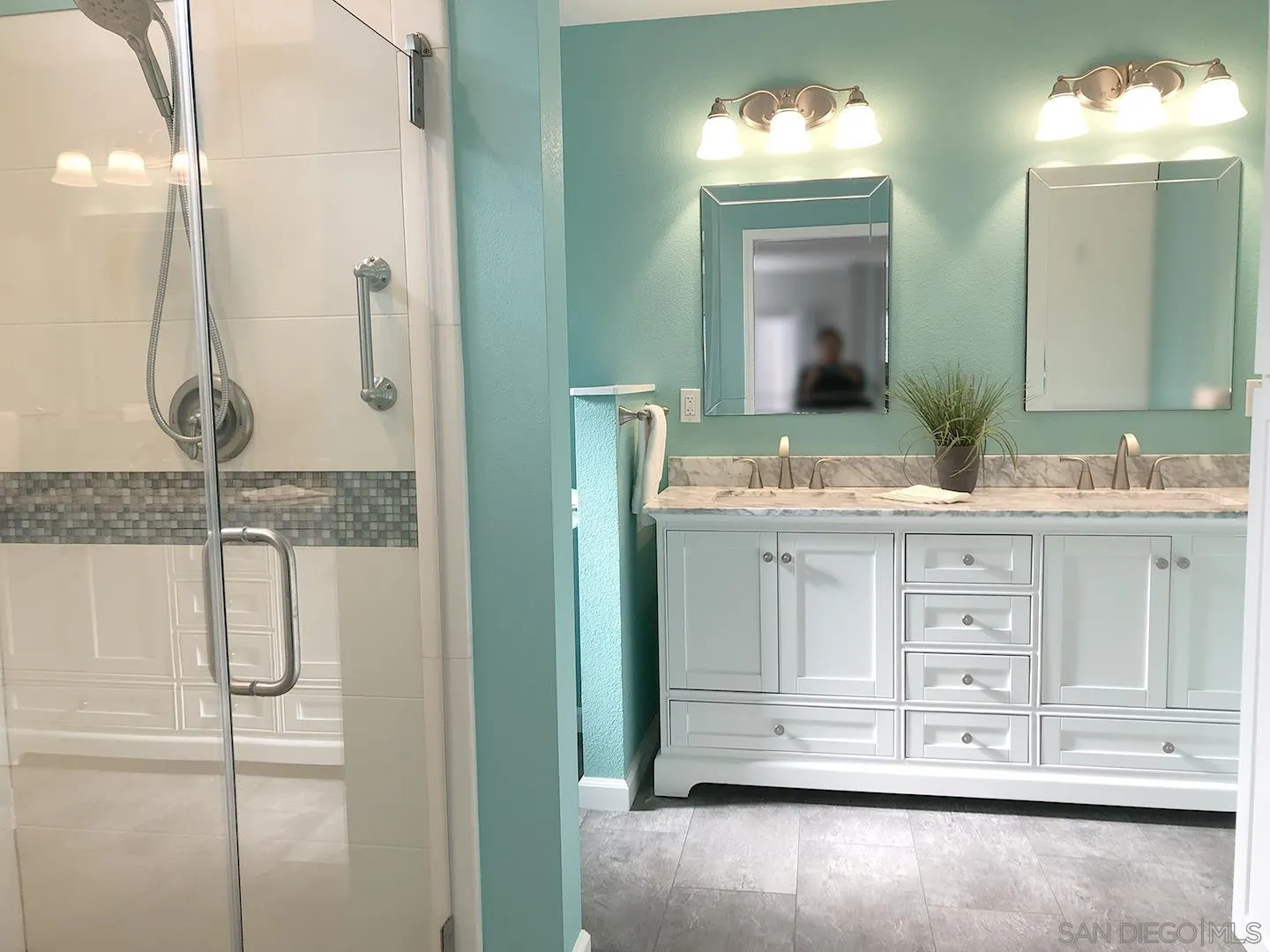 3367 Don Pablo Drive Carlsbad, CA 92010 - Photo 11 of 25 a bathroom with a double vanity sink and a mirror