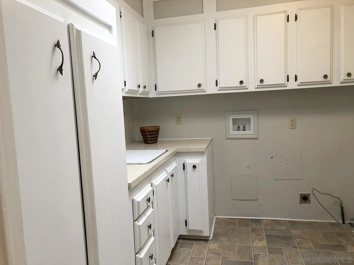 3367 Don Pablo Drive Carlsbad, CA 92010 - Photo 15 of 25 a bathroom with a sink and cabinets