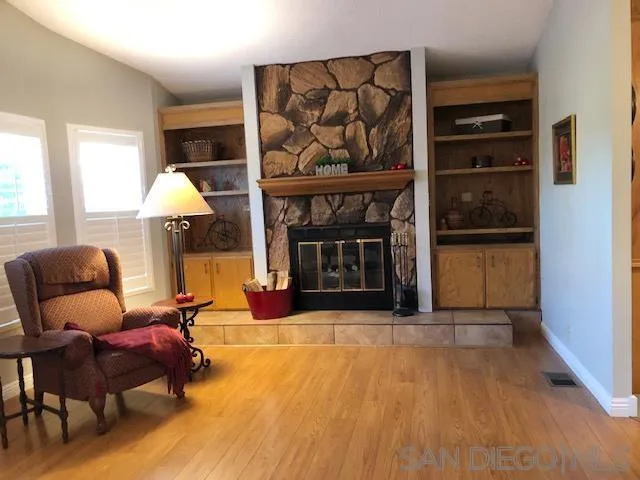3367 Don Pablo Drive Carlsbad, CA 92010 - Photo 2 of 25 a living room with furniture and a fireplace