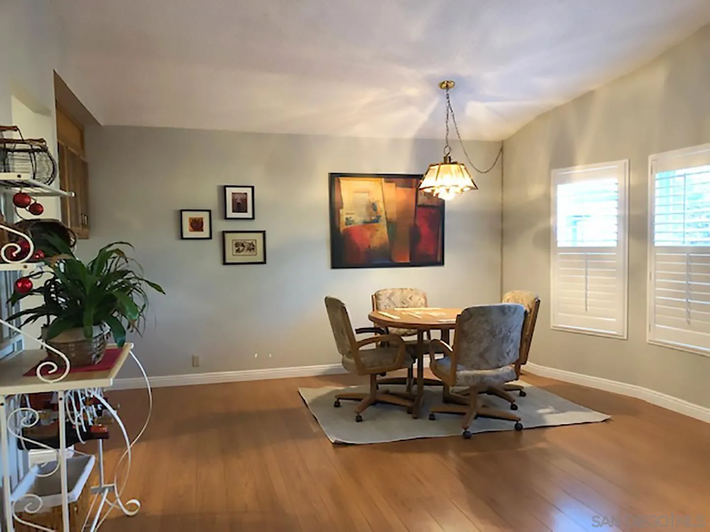 3367 Don Pablo Drive Carlsbad, CA 92010 - Photo 3 of 25 a dining room with wooden floor and a window