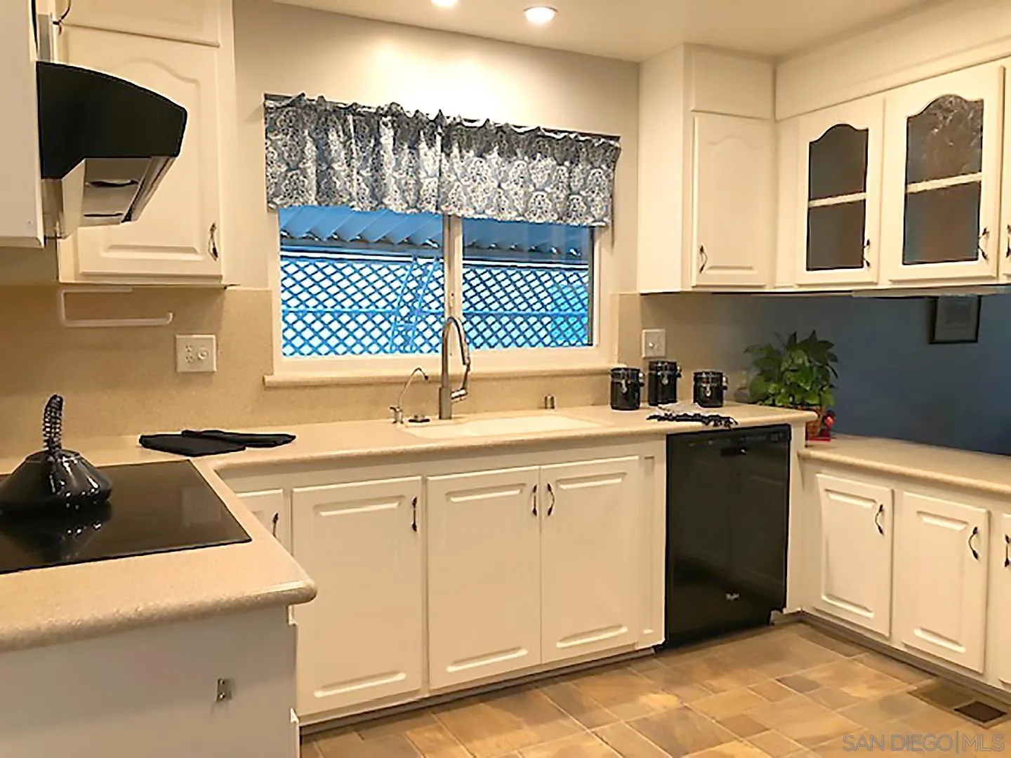 3367 Don Pablo Drive Carlsbad, CA 92010 - Photo 4 of 25 a kitchen with a sink cabinets and window