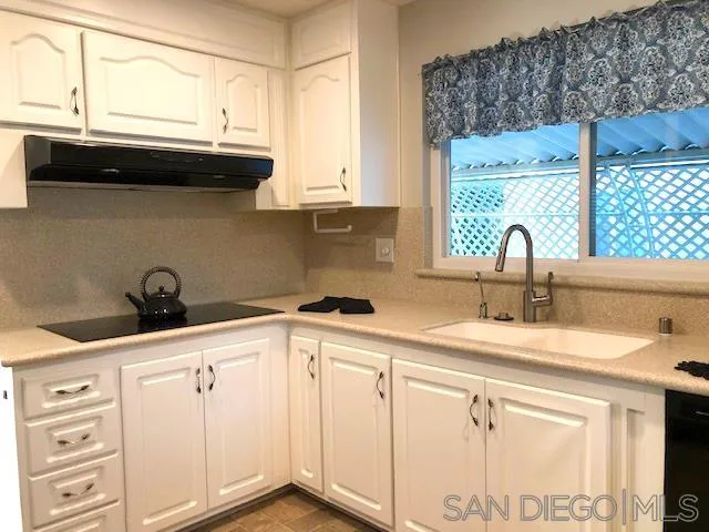 3367 Don Pablo Drive Carlsbad, CA 92010 - Photo 5 of 25 a kitchen with granite countertop a sink and a stove
