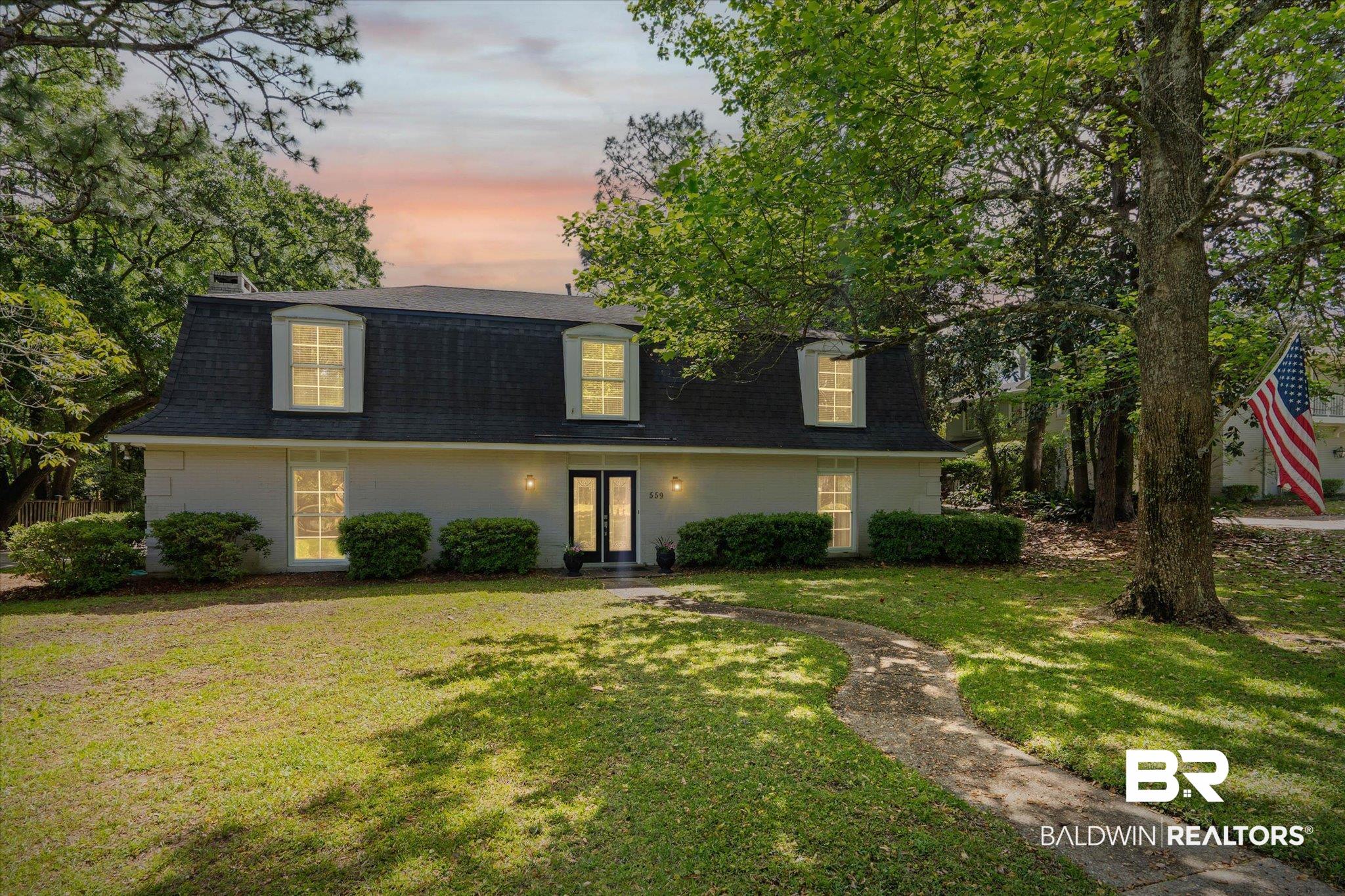559 East Cumberland Road Mobile, AL 36608 - Photo 1 of 48 View of front of property with roof with shingles, a lawn, a gambrel roof, and french doors