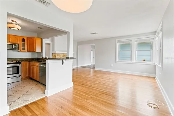 a view of a kitchen with wooden floor
