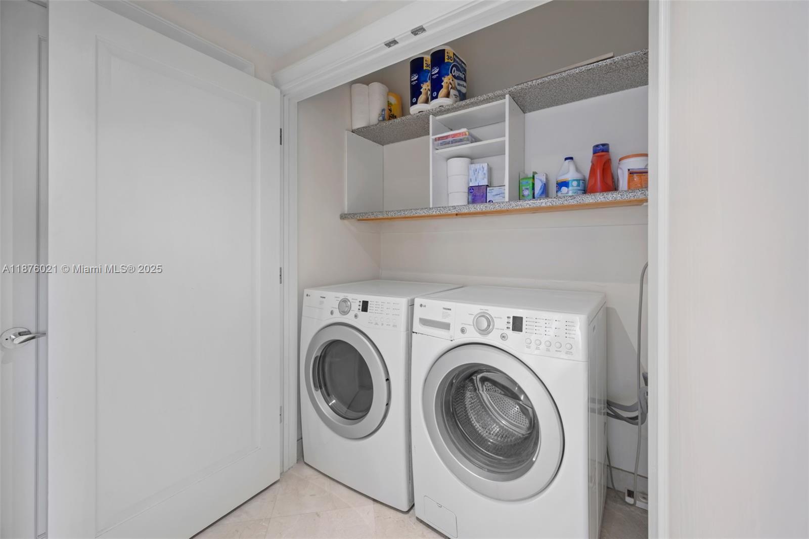 20191 East Country Club Drive, Unit TS8 Aventura, FL 33180 - Photo 19 of 27 a utility room with dryer and washer