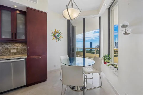 a kitchen with a table and chairs