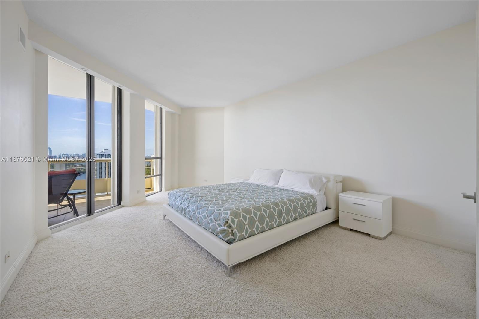 20191 East Country Club Drive, Unit TS8 Aventura, FL 33180 - Photo 9 of 27 a living room with furniture and large windows