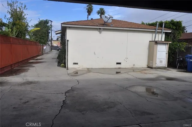 a view of white house with a yard and garage