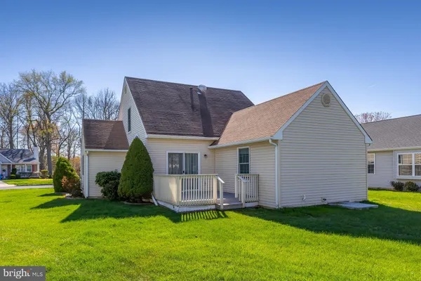 a view of a house with a back yard