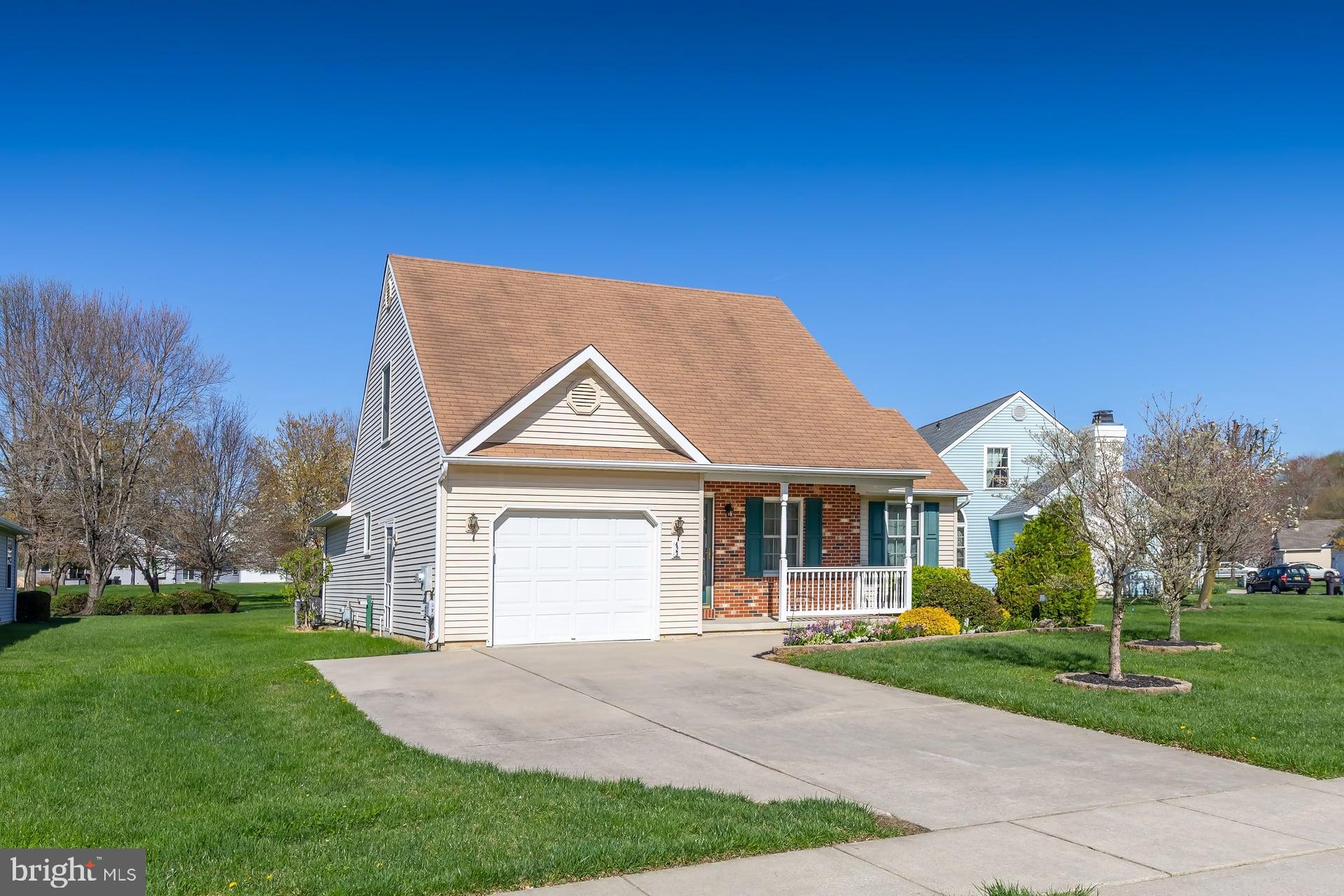 423 Country Way Mickleton, NJ 08056 - Photo 2 of 19 a front view of a house with a yard