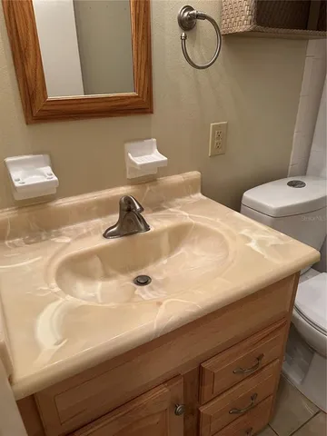 a bathroom with a sink and mirror
