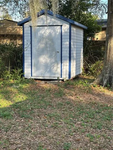 a view of a tiny house with backyard