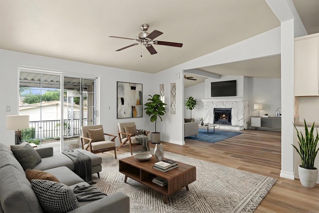 909 Richland Road, Unit 84 San Marcos, CA 92069 - Photo 12 of 35 a living room with furniture fireplace and a large window