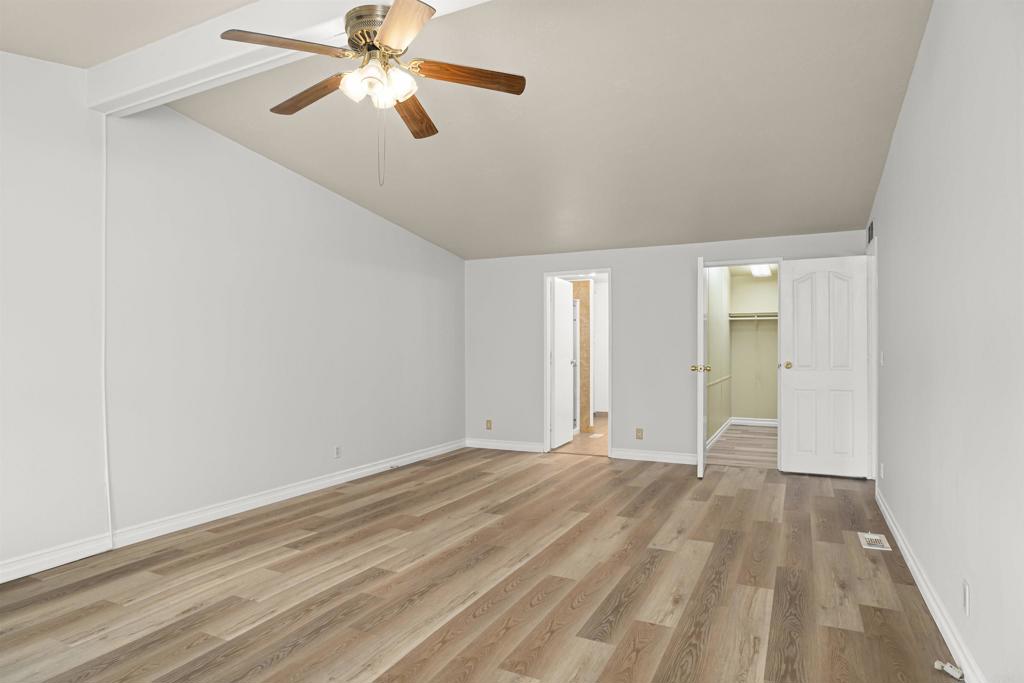 909 Richland Road, Unit 84 San Marcos, CA 92069 - Photo 23 of 35 a view of an empty room with window and a chandelier fan