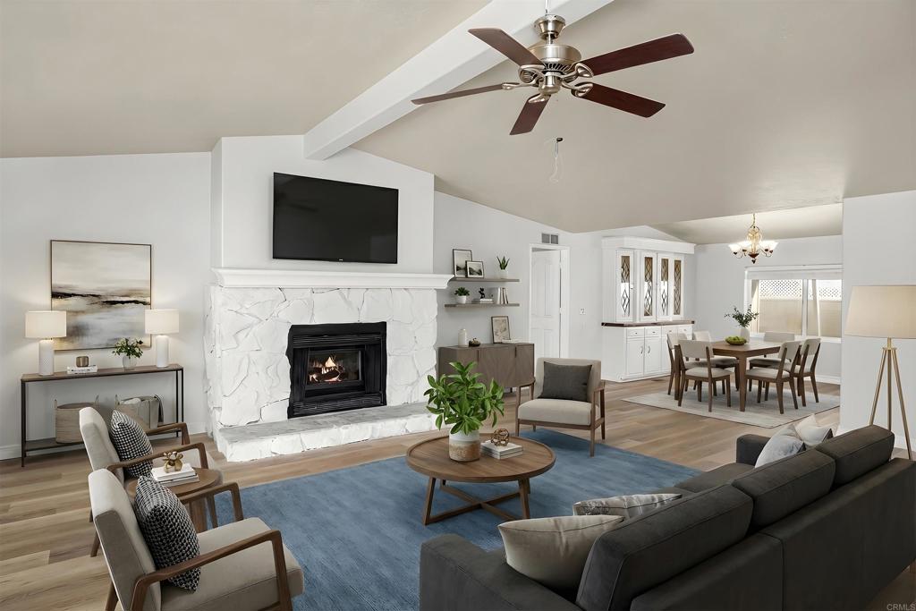 909 Richland Road, Unit 84 San Marcos, CA 92069 - Photo 7 of 35 a living room with furniture a fireplace and a flat screen tv