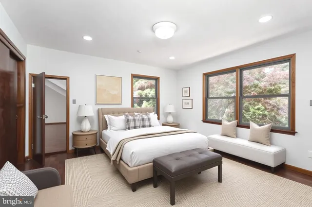 a bedroom with a bed and a couch