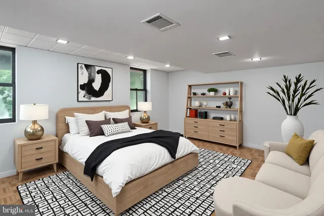 a bedroom with a bed and a couch